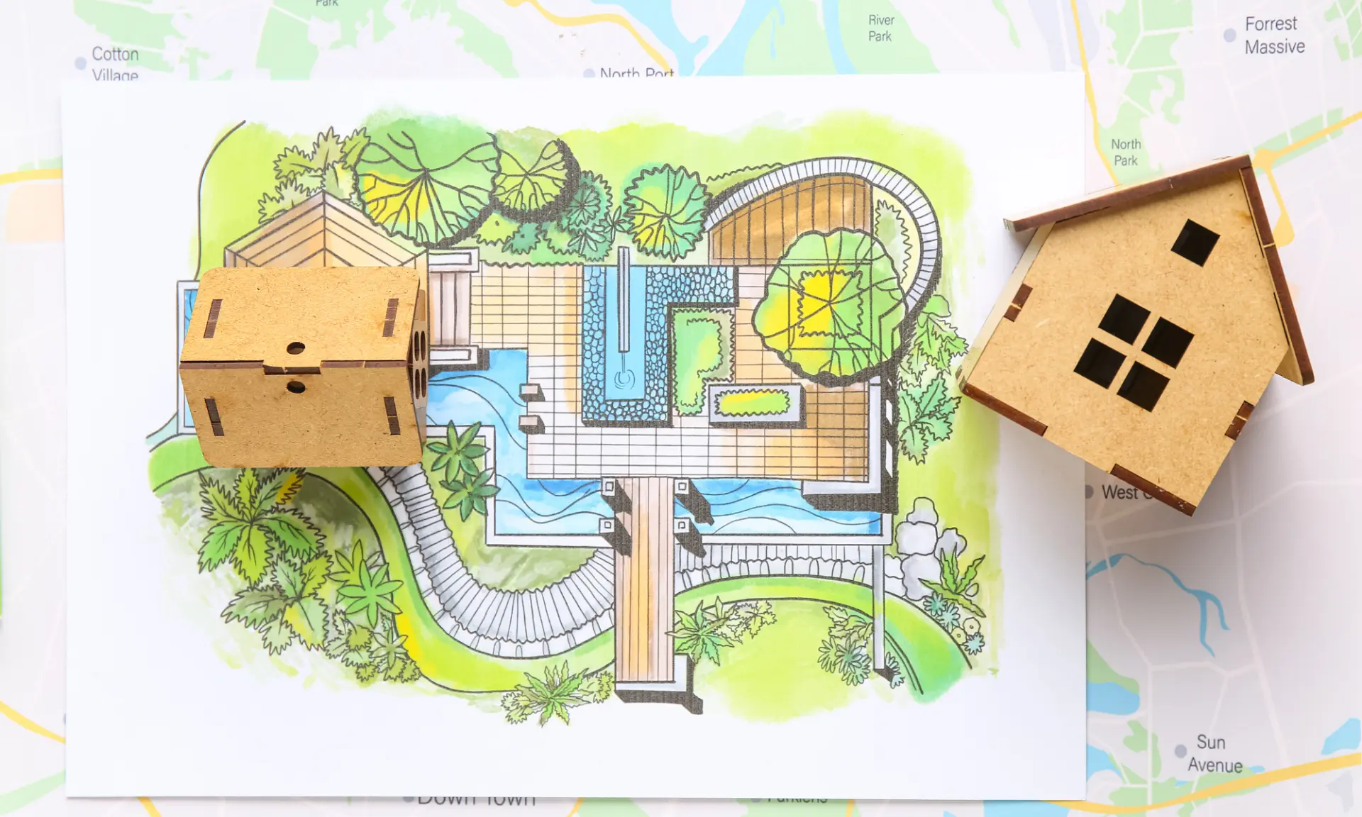 Inrichtingsplan met maquettewoningen op een kaart van een gebied